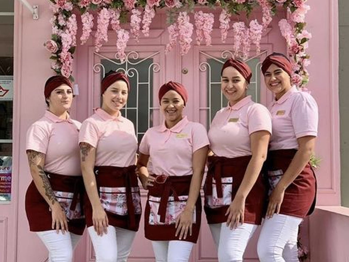 5 bakery ladies posing with tshirt and apron bakery uniform set