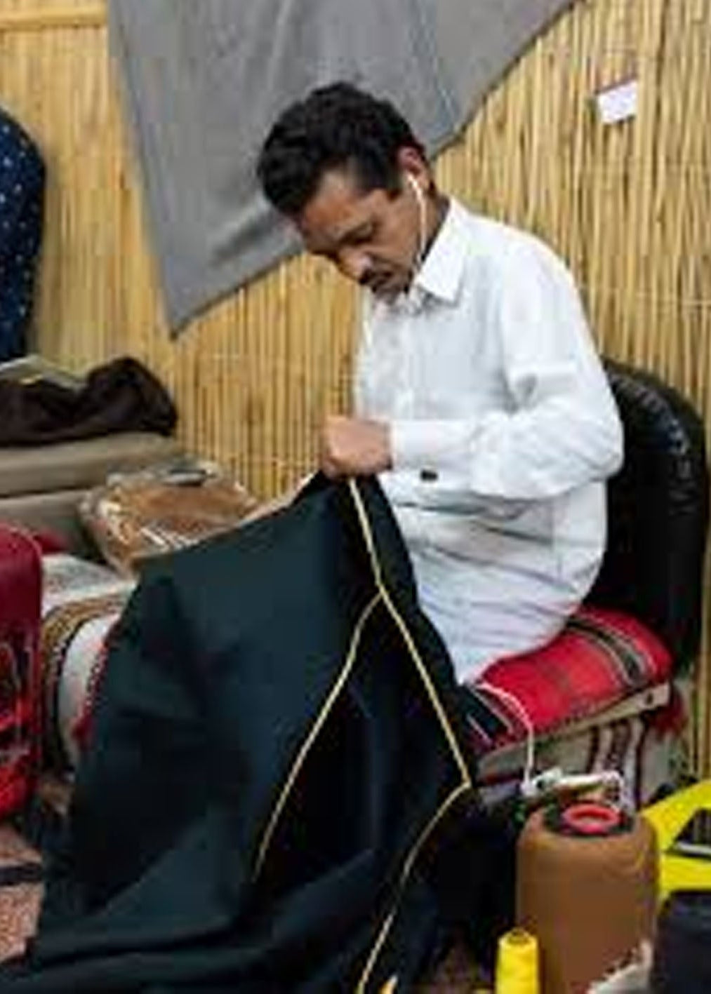 Tailor working on babayaack abaya