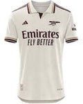 Beige sports jersey with branding on a white background