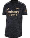 Black sports jersey with gold and white text on a white background