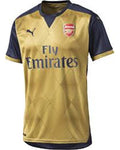 Gold and navy sports jersey with Emirates and Puma logos on a white background