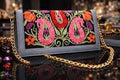 Floral Embroidered Bag on a black surface