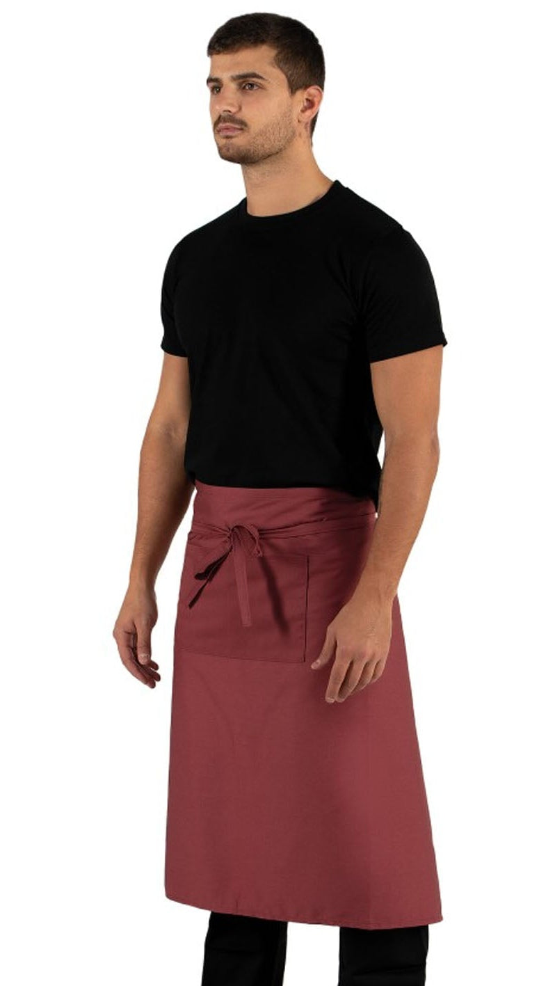 Man wearing a black shirt and red apron on a white background