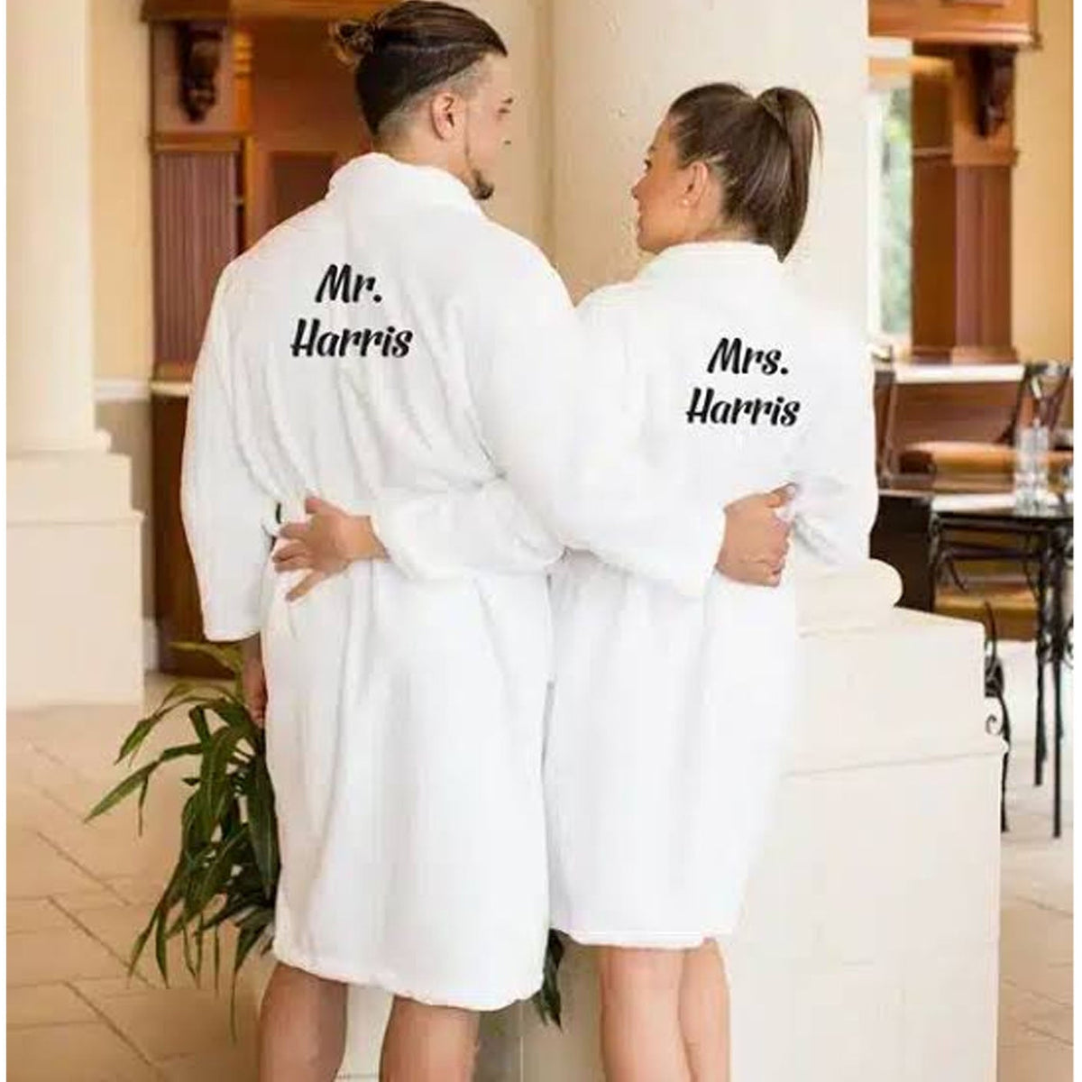 Man and Woman wearing embroidered bath robes