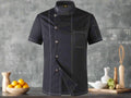 Black chef's coat with white buttons on a white background