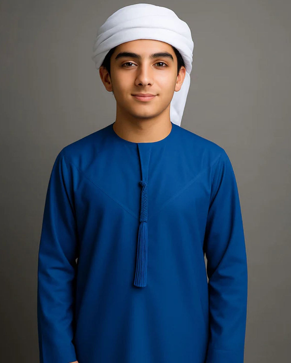 Person wearing a blue traditional outfit with a white headscarf on a gray background