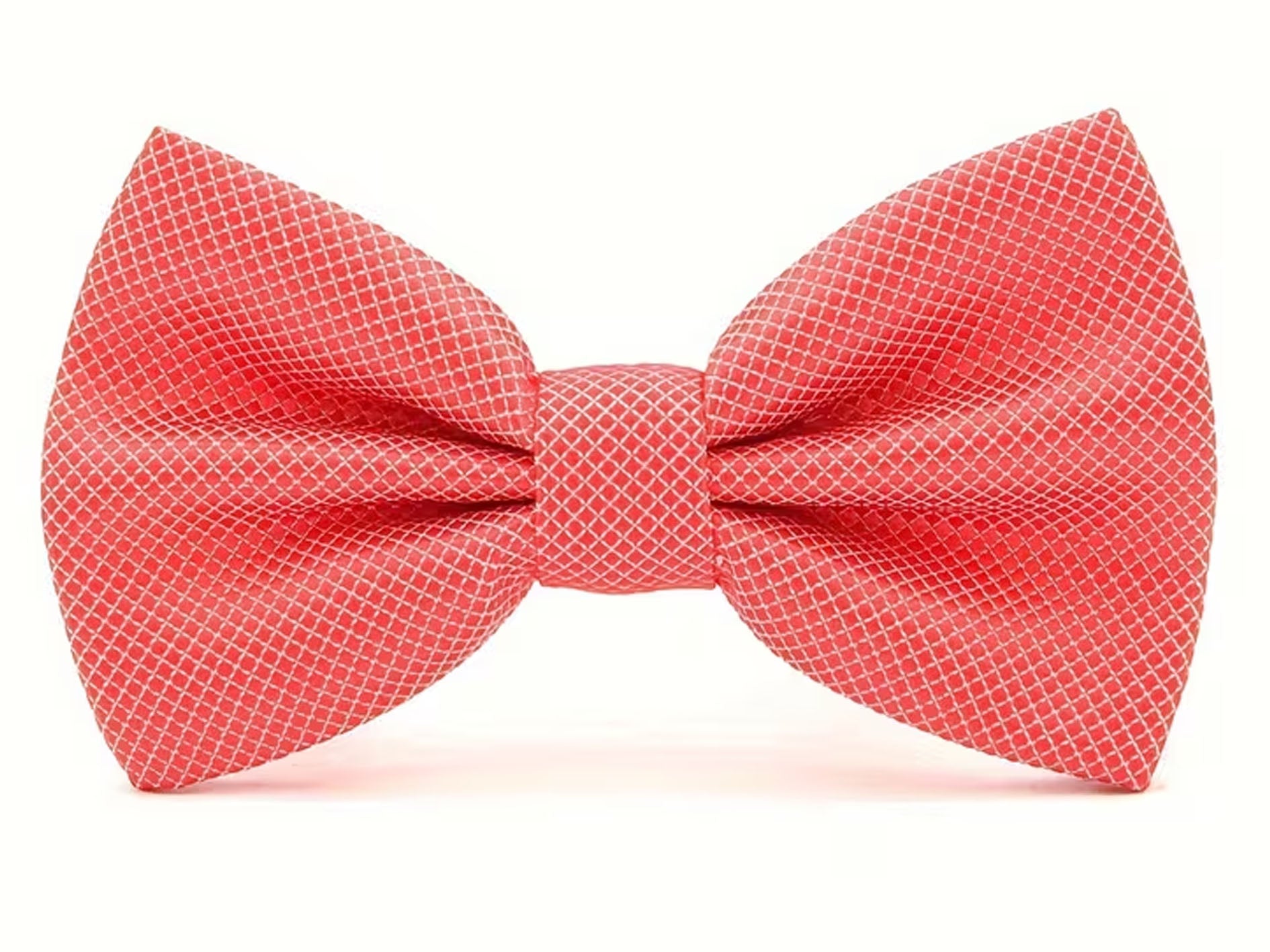 A coral red pre-tied bow tie with a fine white geometric grid pattern, shown against a plain white background.