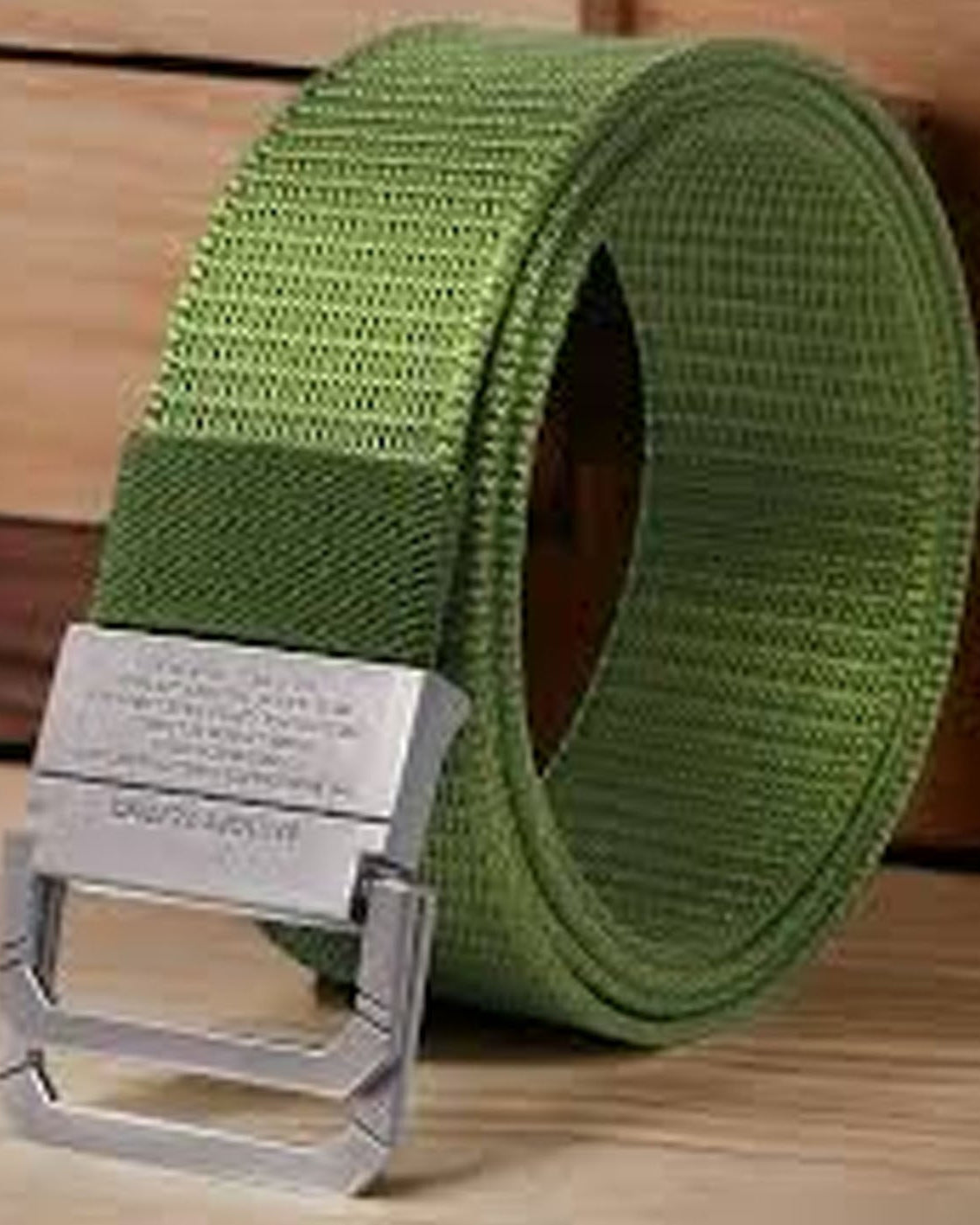 Beige Canvas Belt with metal hooks on a wooden surface