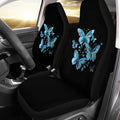 Car seat covers with blue butterfly design inside a vehicle.