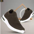 Brown slip-on sneakers with white soles on a gray background