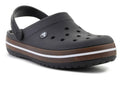 A single black Croc-style clog shoe with a brown and white sole, shown from a three-quarters angle on a white background.