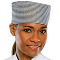 Person wearing a checkered chef's hat on a white background