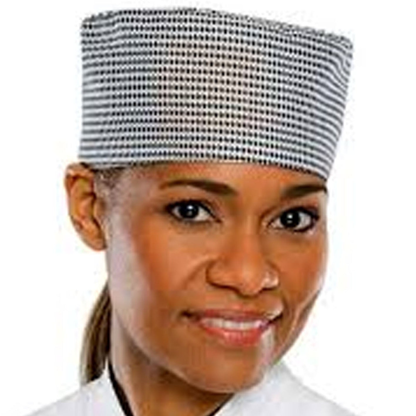 Person wearing a checkered chef's hat on a white background