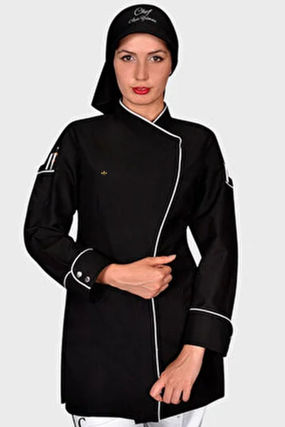 Person wearing a black chef's coat with white trim on a light gray background