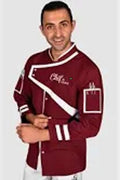 Man wearing a maroon jacket with white accents on a plain background