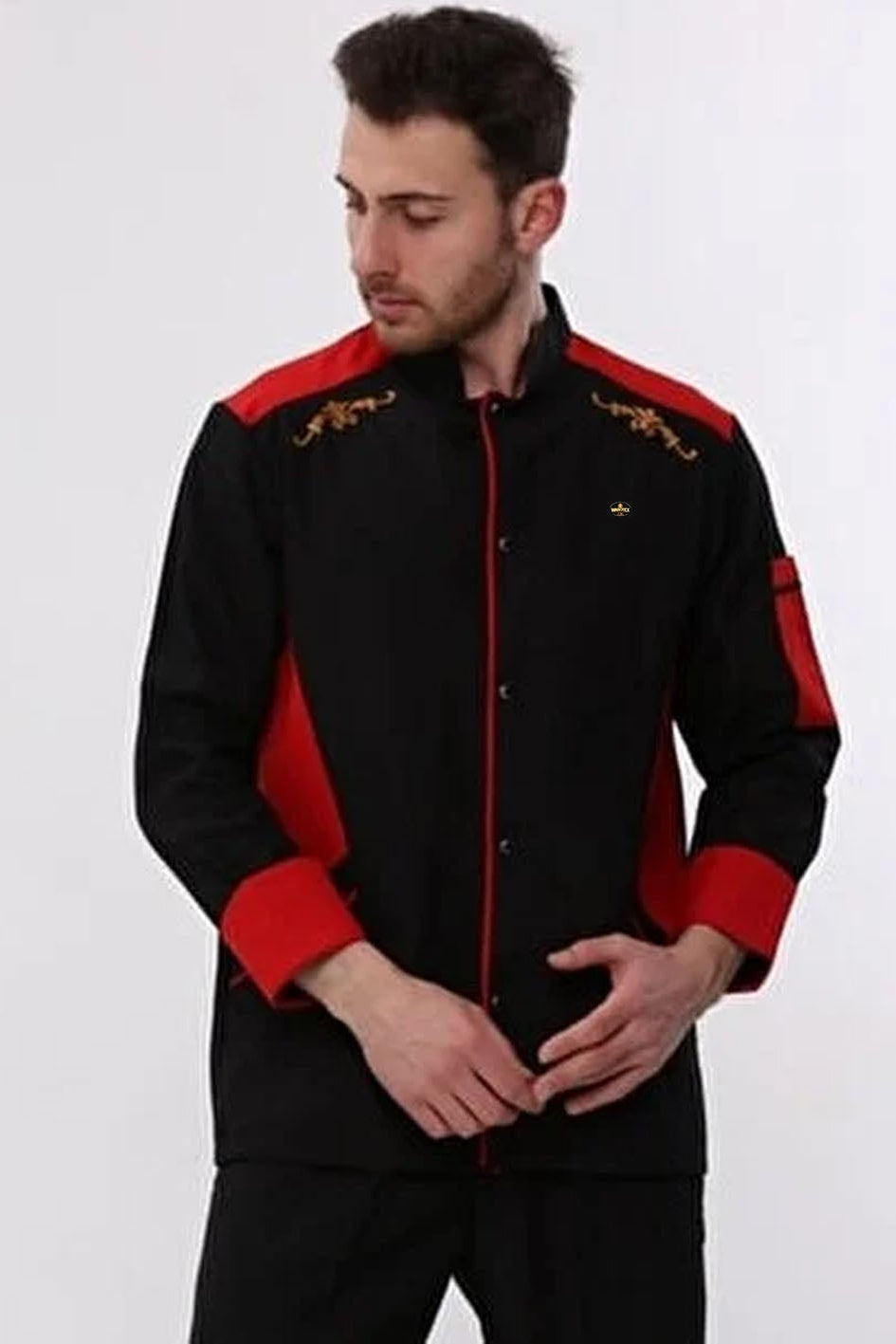 Man wearing a black and red jacket with embroidery on a white background