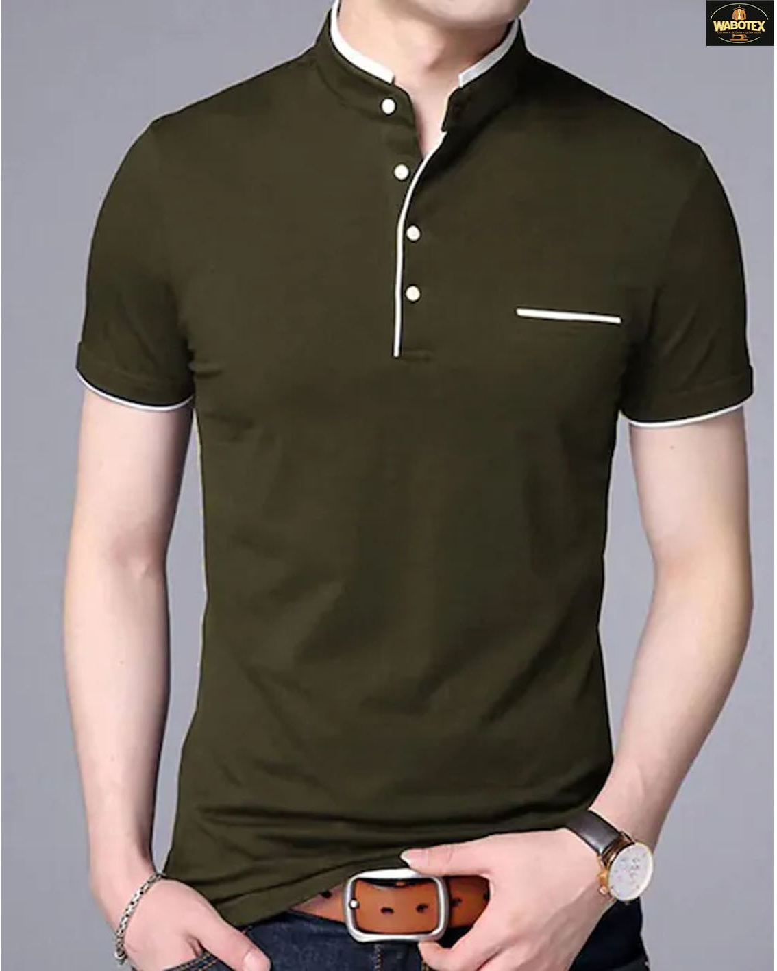 Man wearing a dark green polo shirt with a gray background