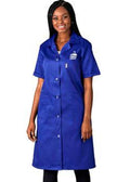 A woman modeling a royal blue short-sleeve lab coat with a white logo on the left chest, set against a plain white background.