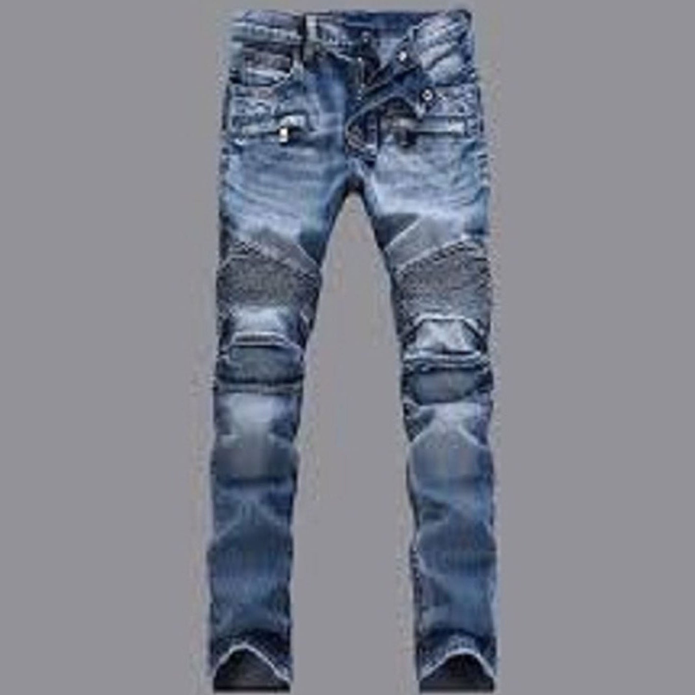 Ripped blue jeans on a gray background