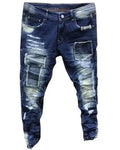 Distressed blue jeans on a white background