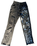 Distressed black jeans with visible wear on a white background