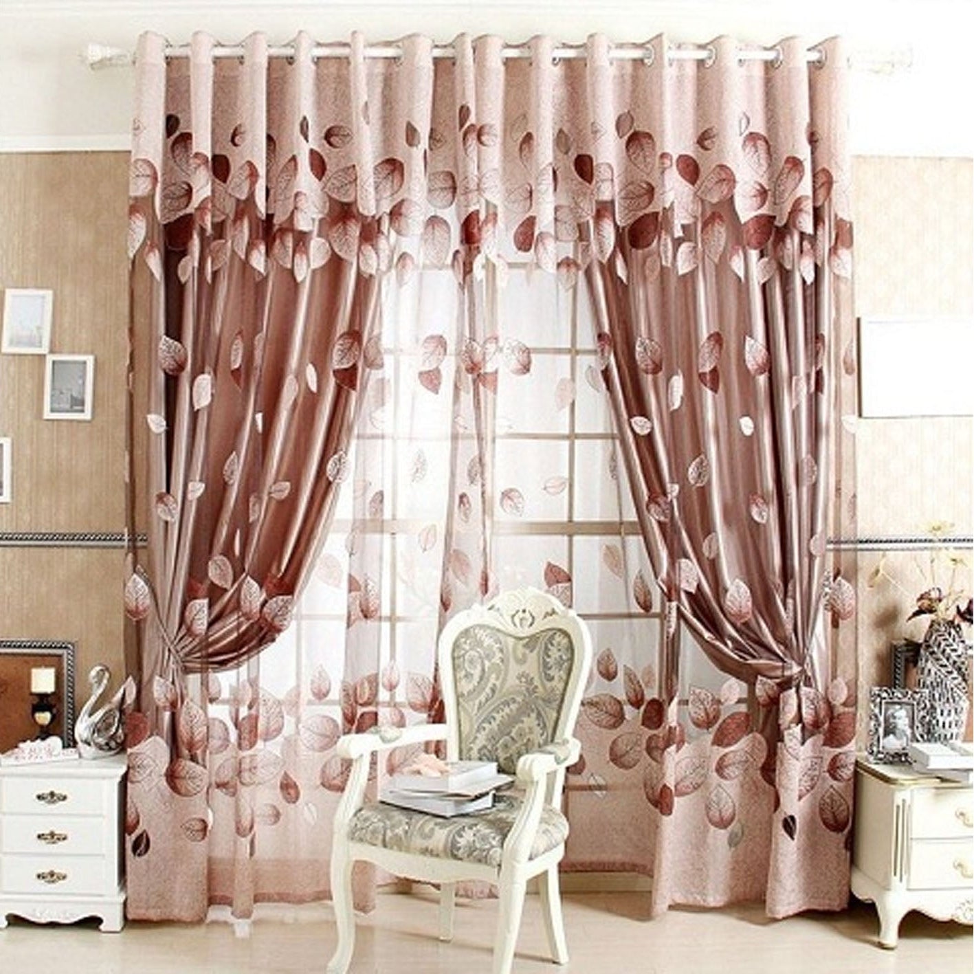 Decorative pink curtains with floral patterns in a room setting.