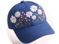 Blue baseball cap with floral embroidery on a white background