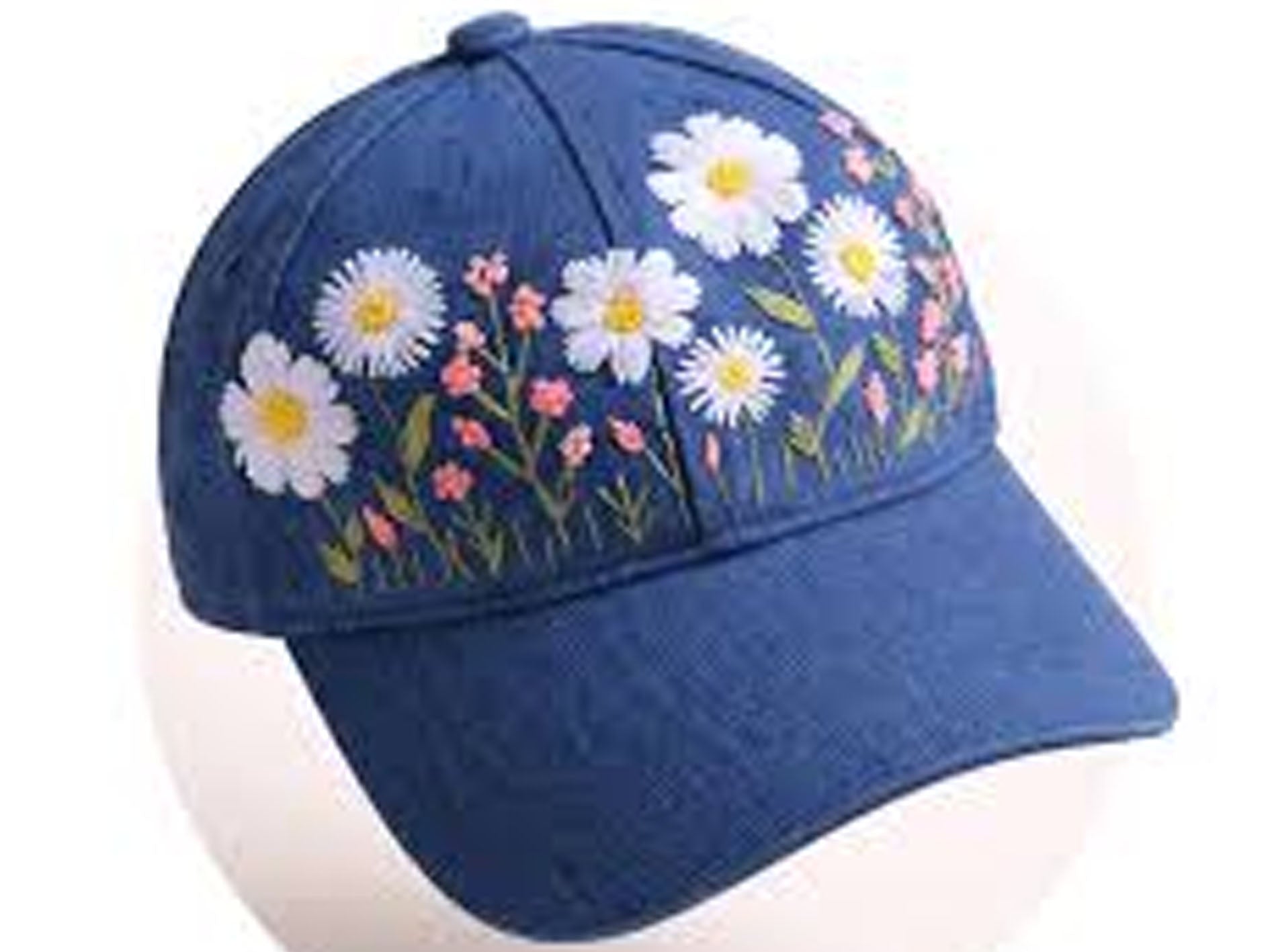 Blue baseball cap with floral embroidery on a white background