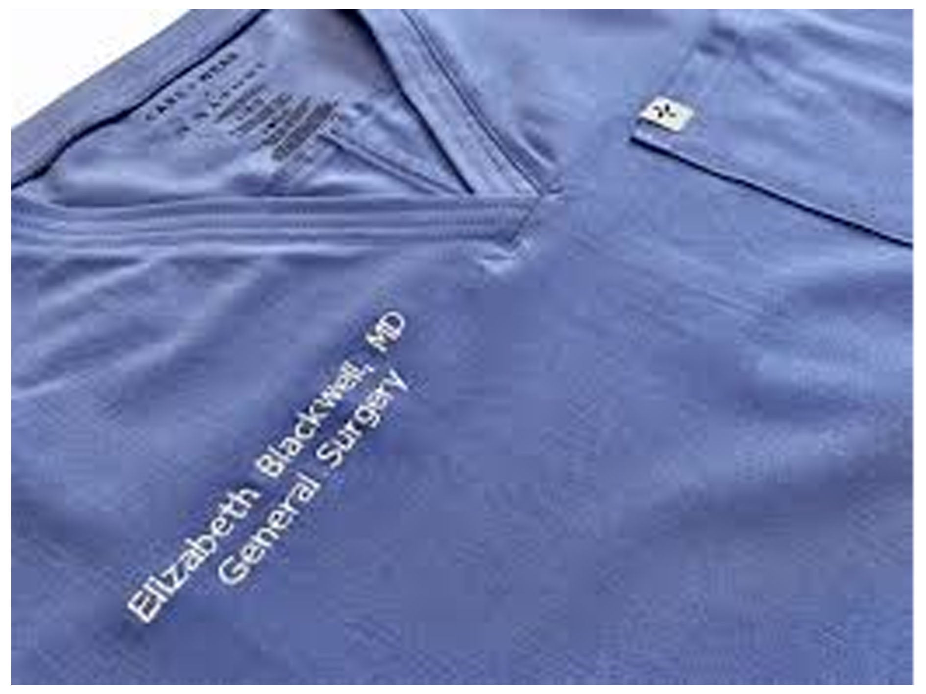 Blue scrub top with 'Elizabeth Blackwell General Surgery' embroidery