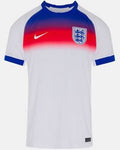A white short-sleeve soccer jersey with a blue and red gradient chest design, featuring a white Nike swoosh and the England crest on the chest.