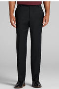 A person wearing black tailored trousers with a burgundy top and black dress shoes, shown from the waist down against a light gray studio background.