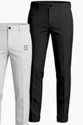 Two pairs of tailored trousers shown on a plain light background: one black pair in front and one white pair behind, both cropped from waist to lower legs with a small printed logo placeholder on the white pair.