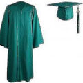 Green graduation gown and cap on a white background