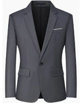 A slim-fit gray blazer with notch lapels, a single button closure, flap pockets, and a white pocket square, shown against a plain white background.
