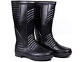 Pair of black rubber boots on a white background