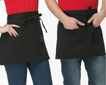 Two people wearing black aprons over red shirts on a white background