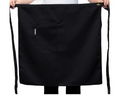 Black drawstring bag held by hands on a white background