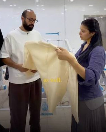 Man showing altered coat to a customer