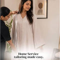 Lady measuring a woman during home alteration service