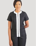 Woman wearing a black and white outfit on a gray background