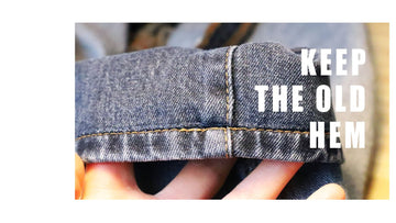 Rolled-up denim jeans with text 'KEEP THE OLD HEM' on a white background