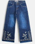 A pair of blue denim jeans with decorative white embroidered floral patterns and silver-toned studs along the lower hems, shown against a plain light background.
