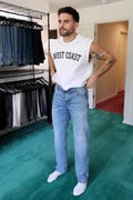 Man wearing  finished altered jeans fit to size