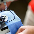 Macj=hine showing stitching of altered jeans
