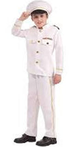Child wearing a white captain's outfit with a hat on a white background