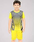 Child wearing a yellow and gray sports outfit on a plain background