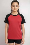 Person wearing a red and black sports outfit on a plain background