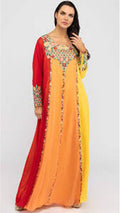 Woman wearing a colorful dress with a gradient from red to yellow on a white background