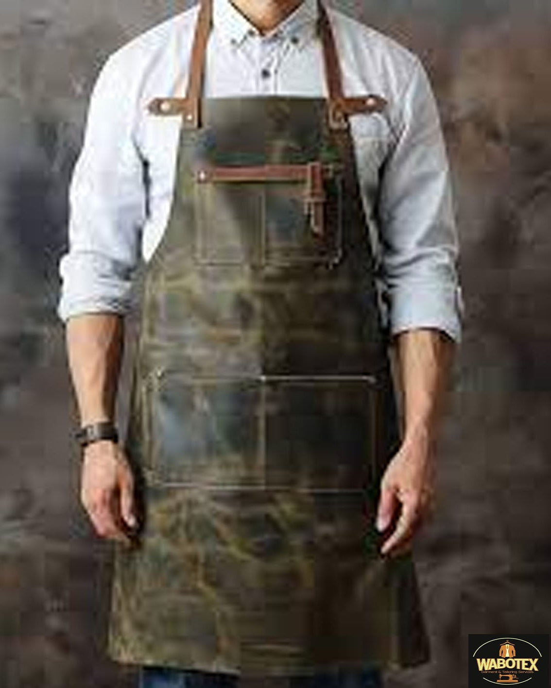 Person wearing a leather apron with a textured background