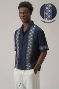 A boy wearing a Linen shirt with embroidery